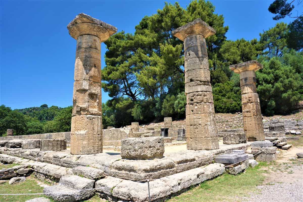 An ancient Olympia tour stops at the columns of the Temple of Hera