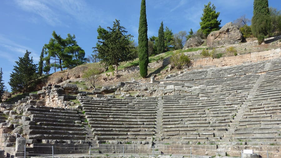An Athens day trip to Delphi reaches the ancient theatre on the slopes above the sanctuary of Apollo