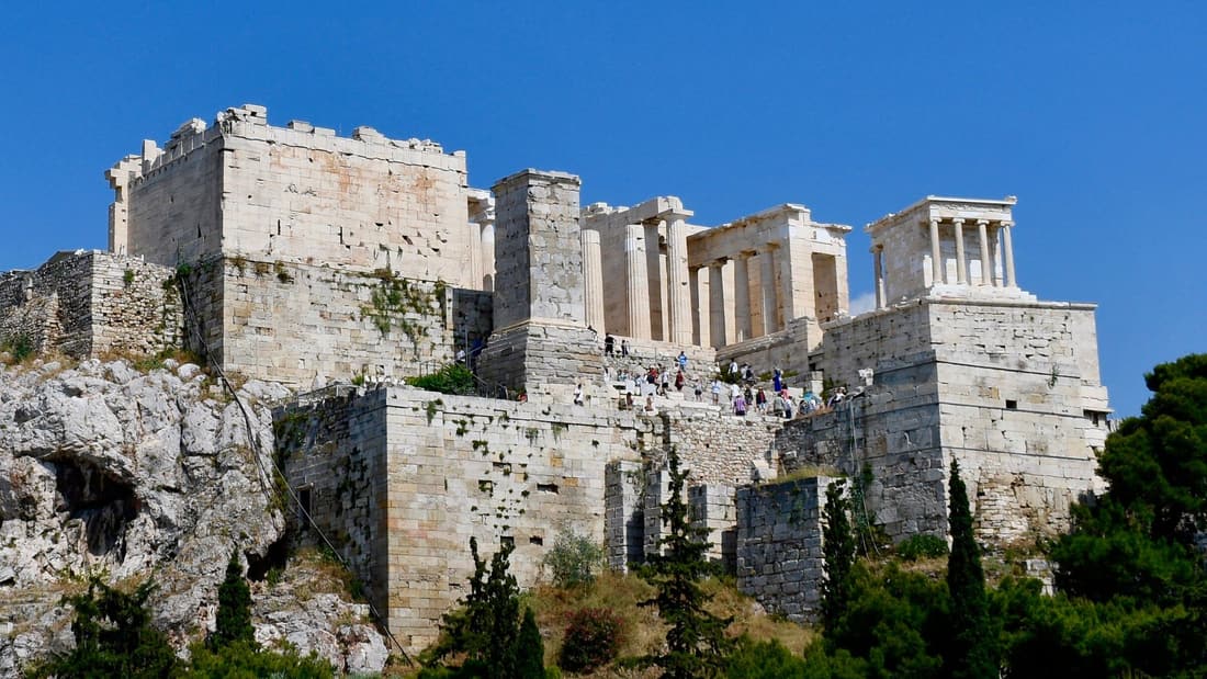 An Athens walking tour passes below the Propylaea and the Temple of Athena Nike on the Acropolis
