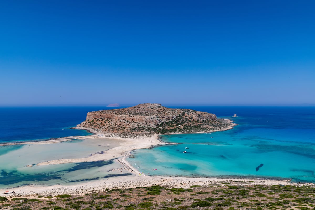 A Balos lagoon cruise reaches the shallow turquoise lagoon of Balos in Crete