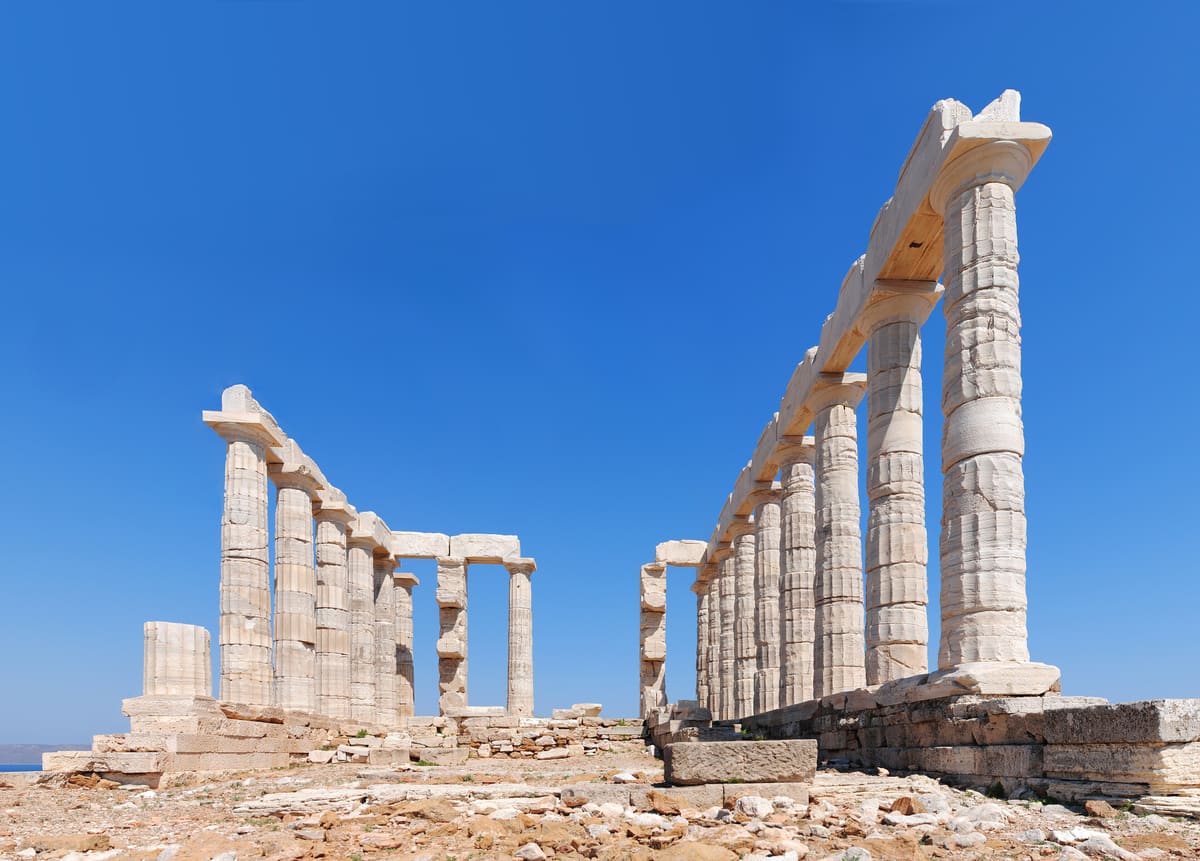 A Cape Sounion tour reaches the Temple of Poseidon on the cliff