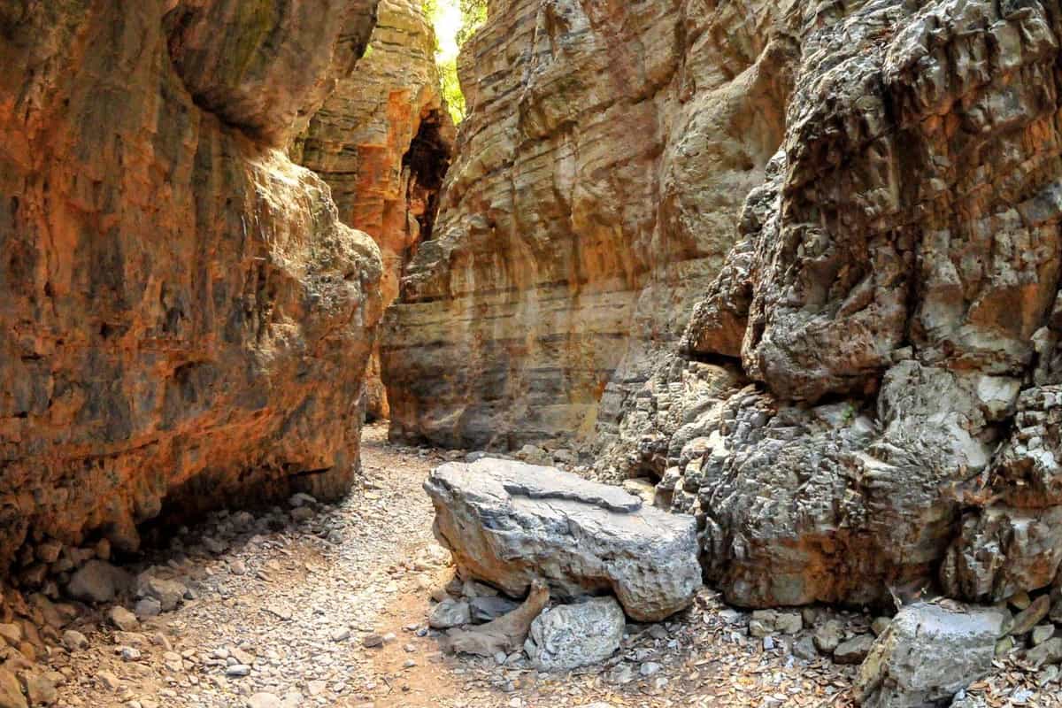 Chania hiking tour path through the narrow rock walls of a gorge in western Crete