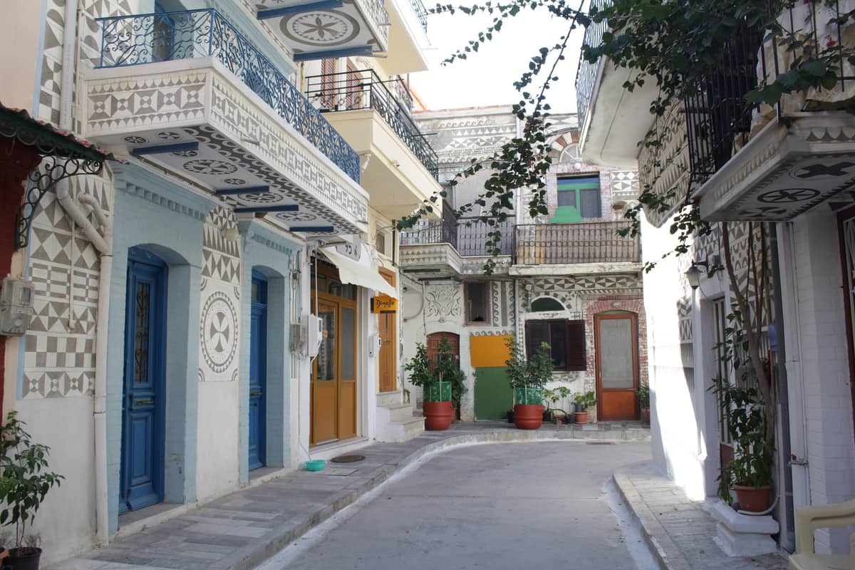 A Chios tour walks the lanes of Pyrgi, the mastic village whose houses are covered in black and white xysta patterns