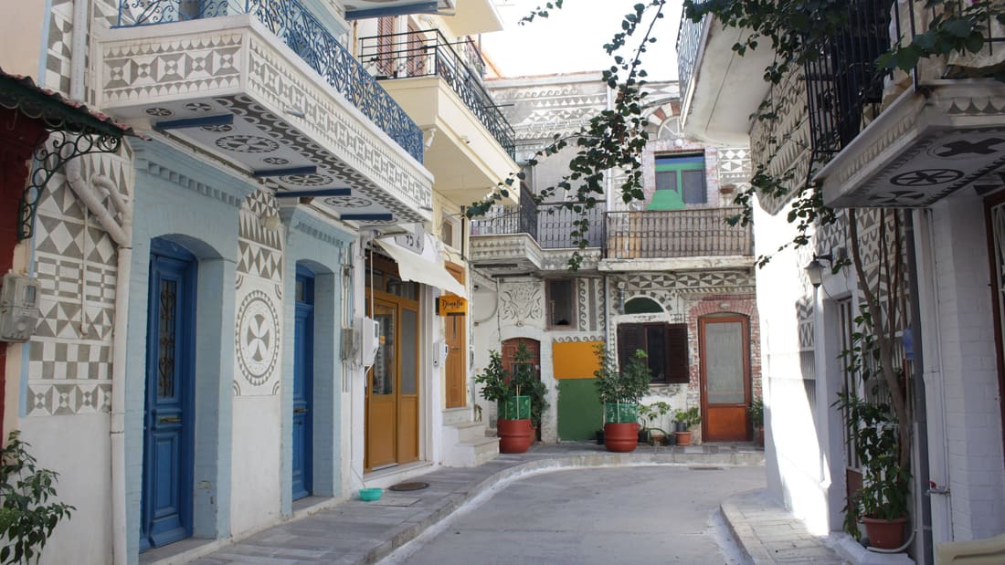 A Chios tour walks the lanes of Pyrgi, the mastic village whose houses are covered in black and white xysta patterns
