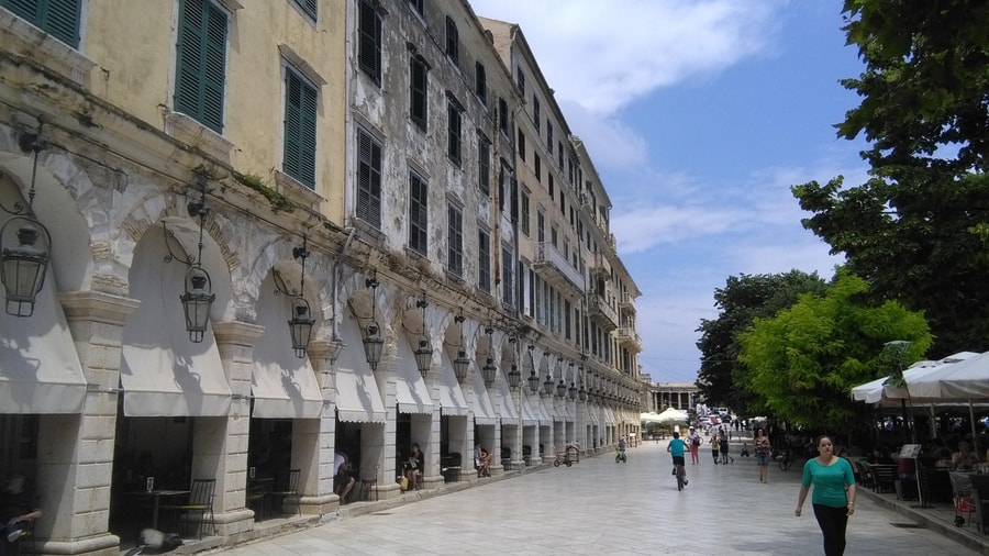 A Corfu Old Town walking tour passes the arcades and lanterns of the Liston beside the Spianada