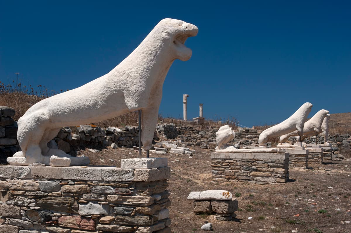 A Delos tour reaches the marble lions on the Terrace of the Lions