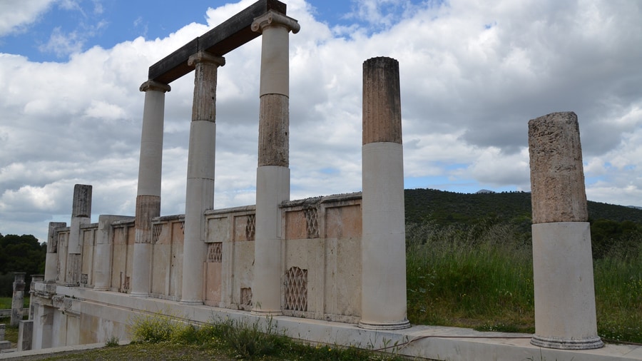 An Epidaurus tour walks past the restored columns of the Abaton, where the sick slept in the Sanctuary of Asclepius