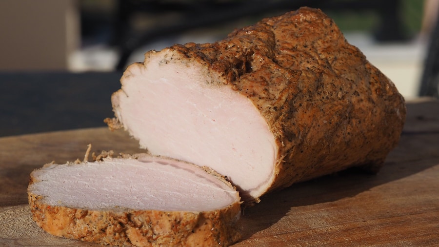 A Heraklion food tour serves apaki, the smoked and spiced pork of Crete, sliced for the meze table