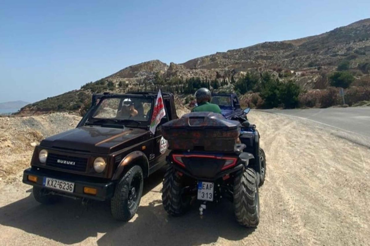 A Kos ATV tour quad bike and an open jeep stop on a dusty hill road above the sea