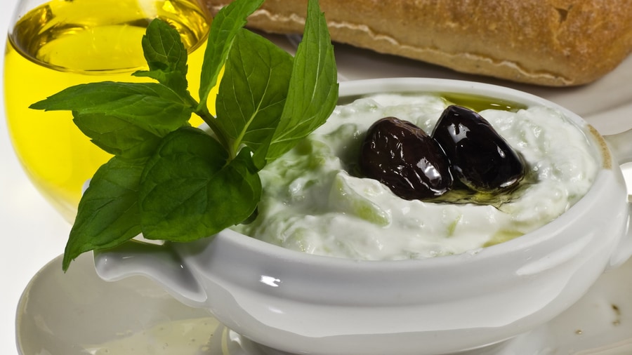 A Kos food tour serves meze such as tzatziki with olives, bread and olive oil
