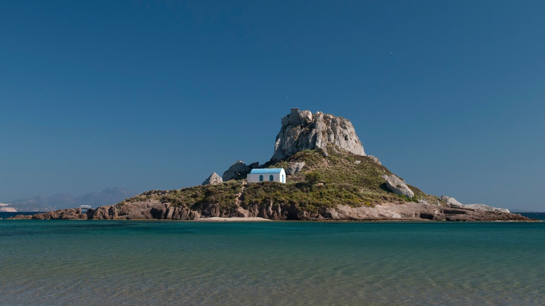 A Kos island tour reaches Kastri islet and the white chapel of Agios Nikolaos off Kefalos bay