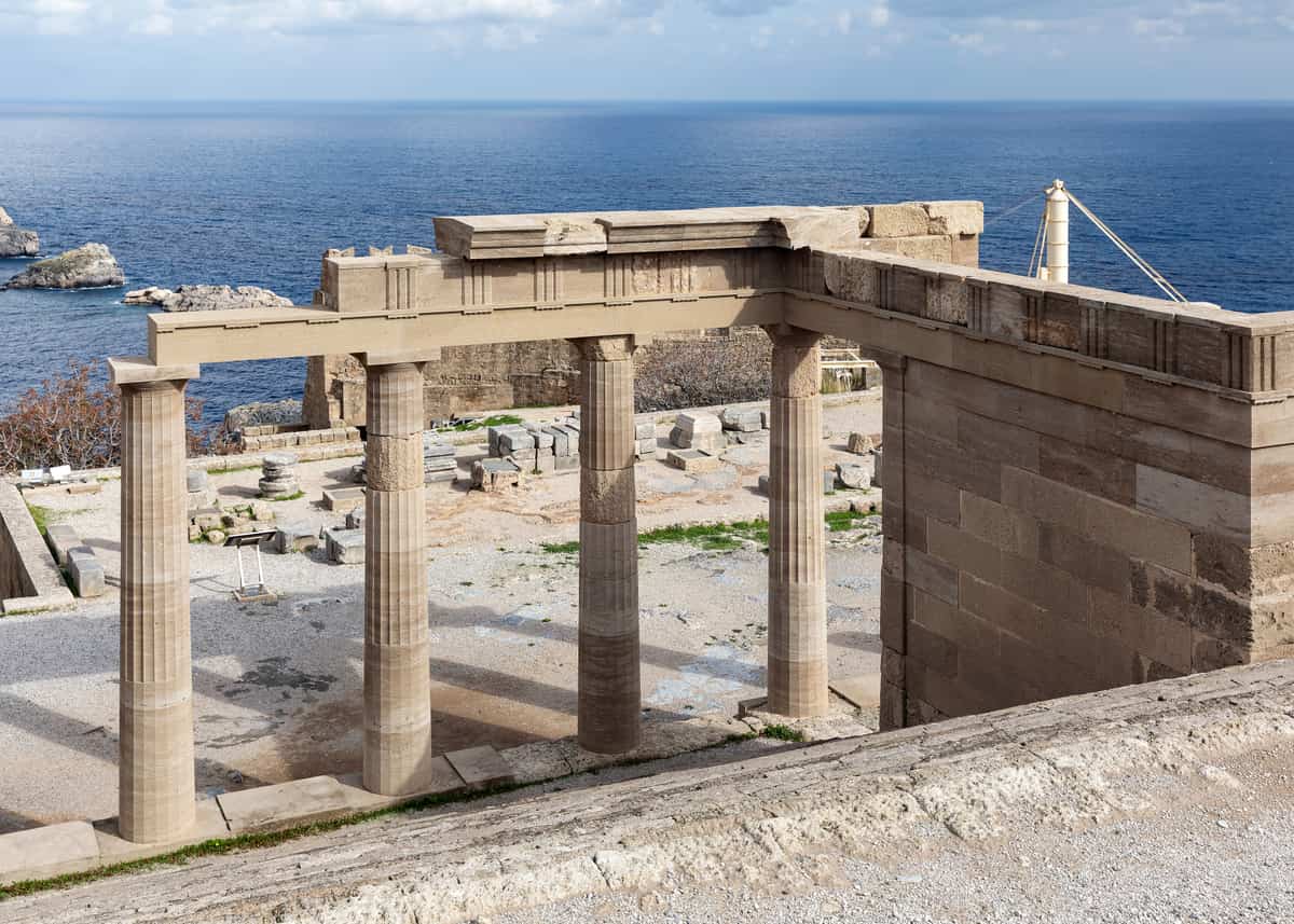 A Lindos tour climbs to the temple on the Acropolis of Lindos