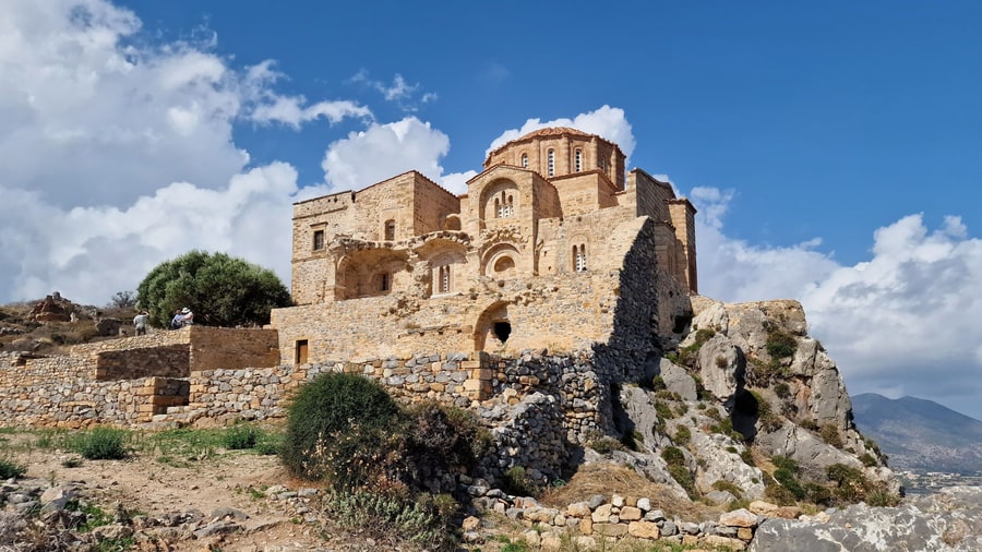 A Monemvasia tour climbs to the Byzantine church of Agia Sofia on the edge of the upper town