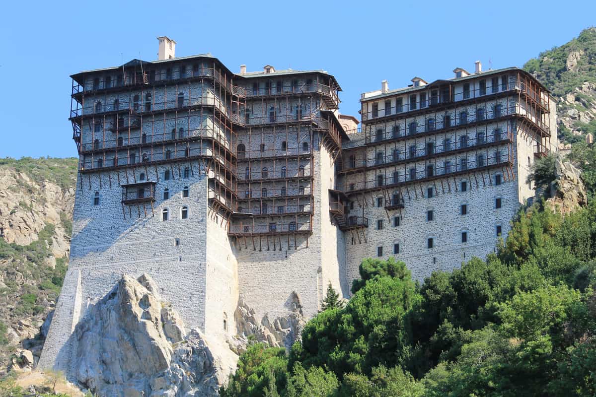 A Mount Athos cruise passes Simonopetra Monastery on its rock above the sea