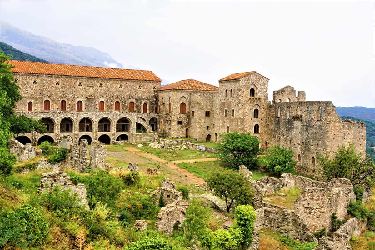 A Mystras tour reaches the Palace of the Despots, the restored Byzantine palace below the castle hill