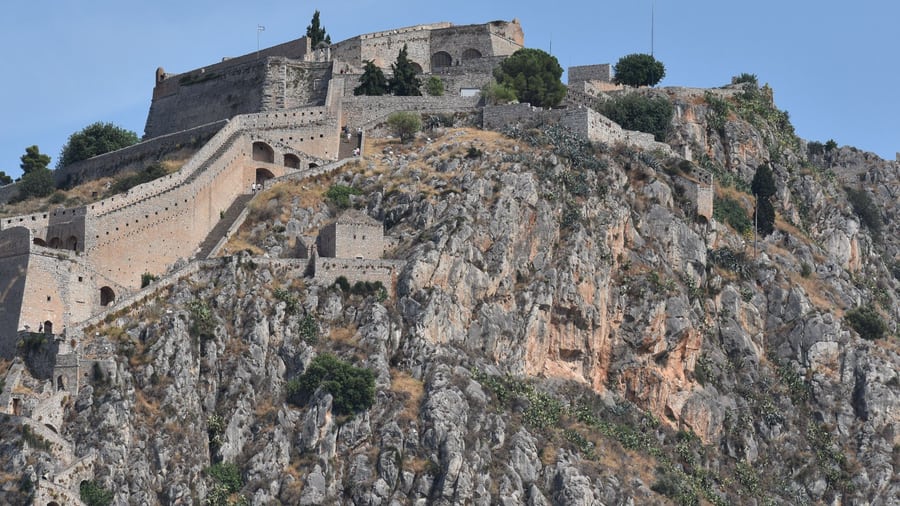 A Nafplio day trip looks up at the walls and bastions of Palamidi fortress on its rock