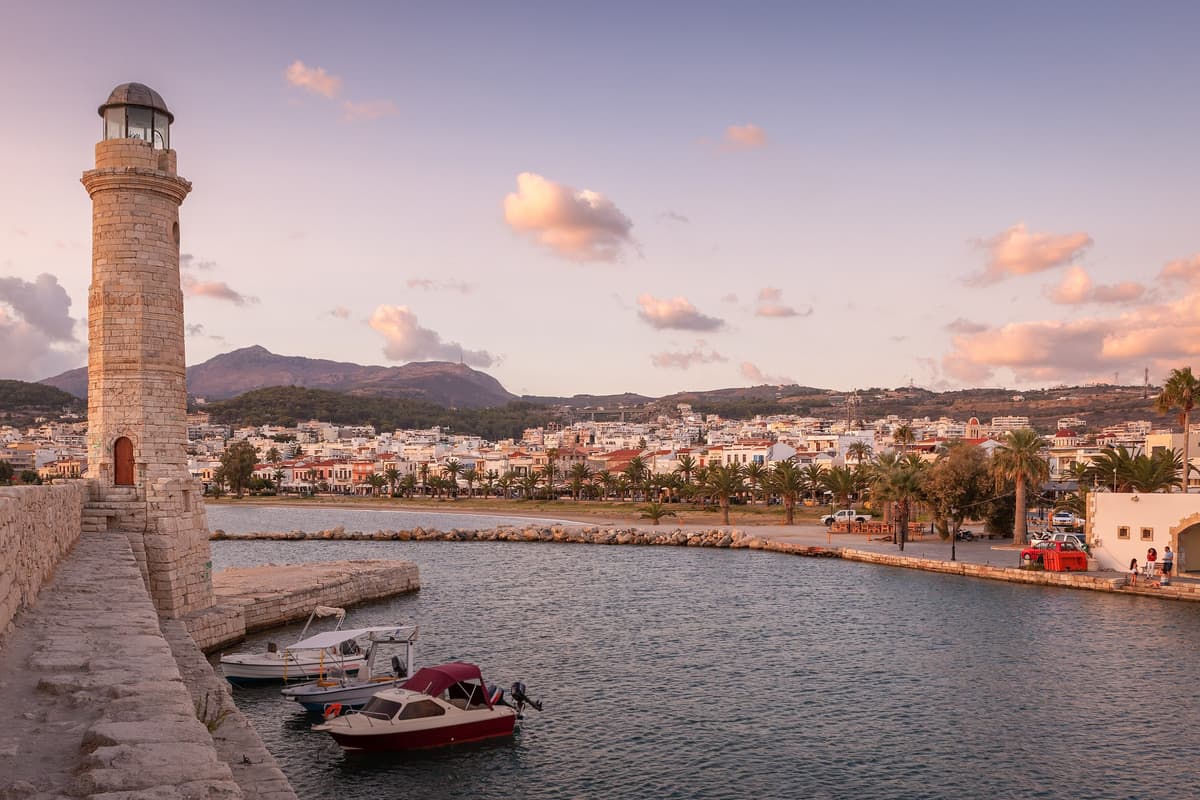 A Rethymno food tour ends at the Venetian harbour, where the old lighthouse stands at the end of the stone mole