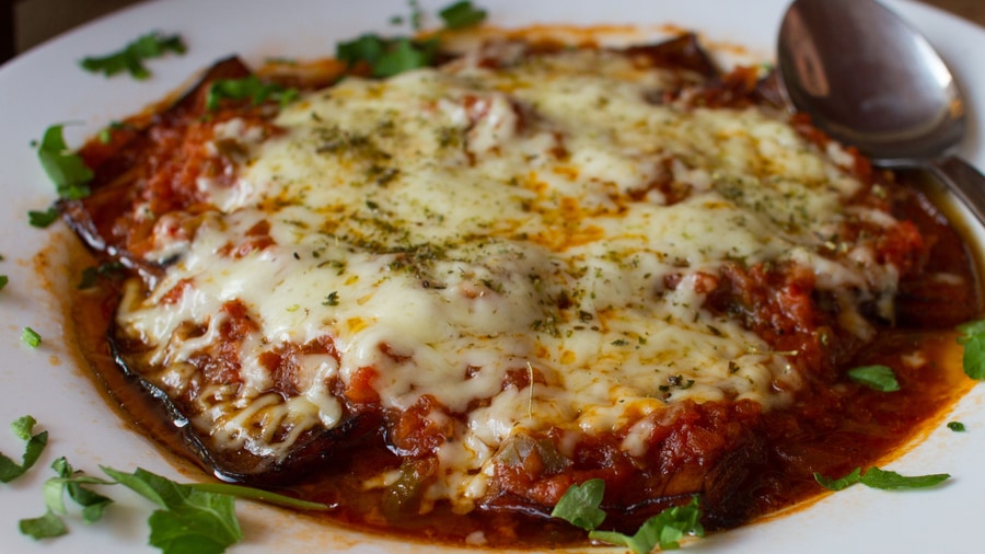 A Rhodes food tour serves moussaka with melted cheese and tomato sauce at a taverna on Rhodes