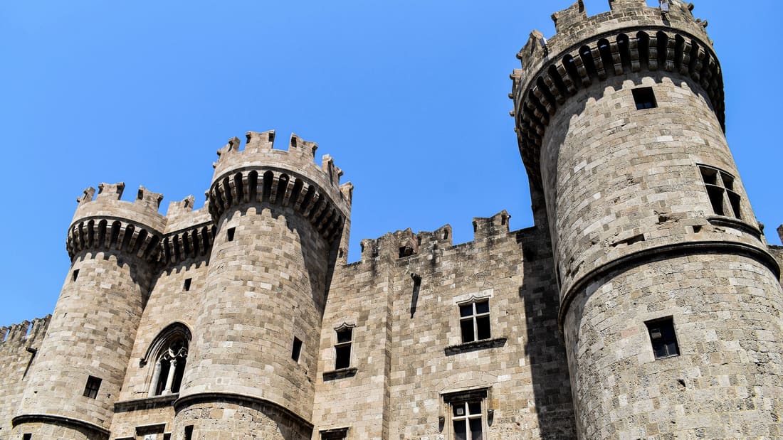 A Rhodes old town tour starts below the towers of the Palace of the Grand Master of the Knights