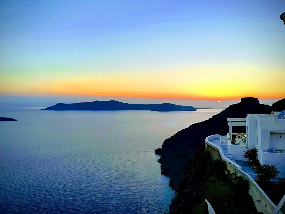 A Santorini sunset tour watches the sun set over the caldera from Imerovigli