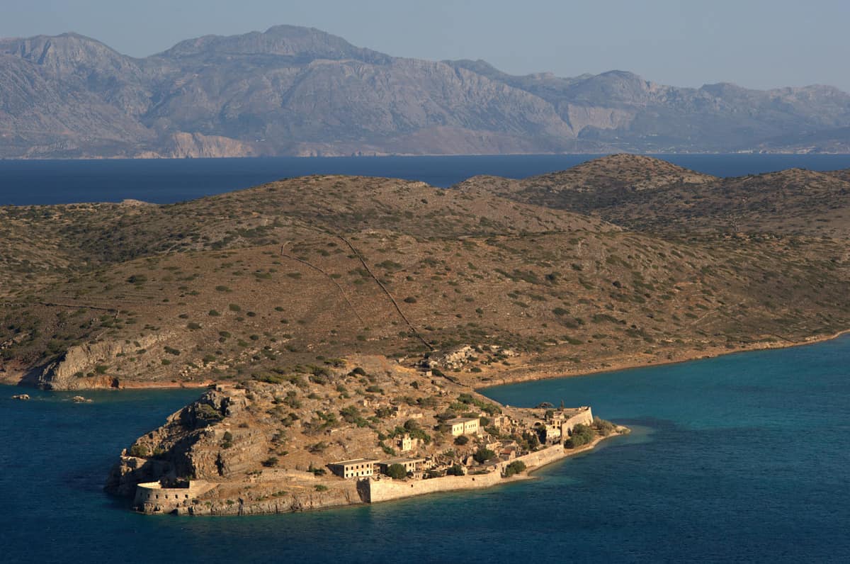 A Spinalonga tour crosses to the island of Spinalonga in the Gulf of Elounda