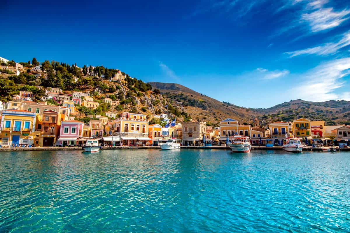 A Symi day trip from Rhodes arrives in the harbour of Gialos on Symi