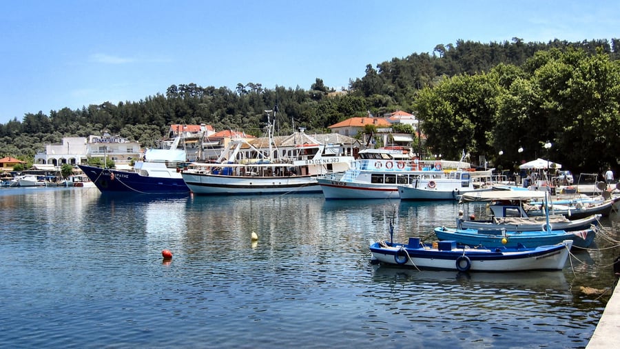 A Thassos boat trip leaves from the harbour of Limenas, where tour boats and fishing boats line the quay