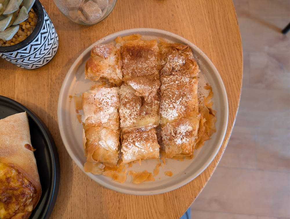 A Thessaloniki food tour serves bougatsa with custard dusted with sugar